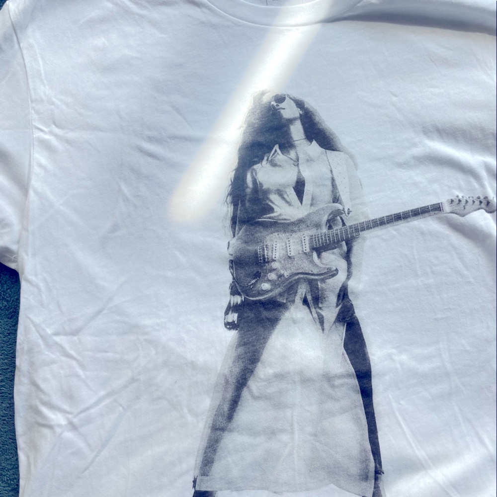 HER T-shirt.